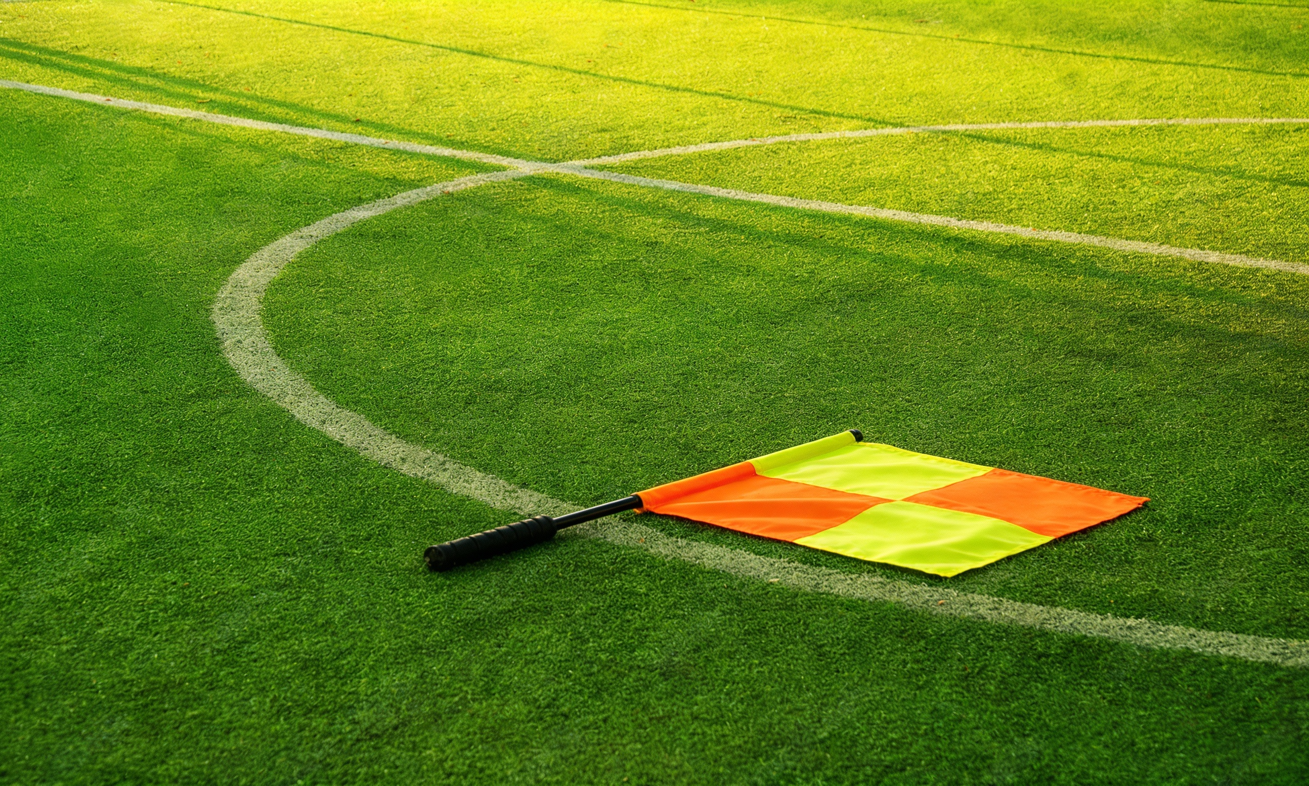 freepik__add-a-flag-from-the-assistant-referee-on-the-field__96751
